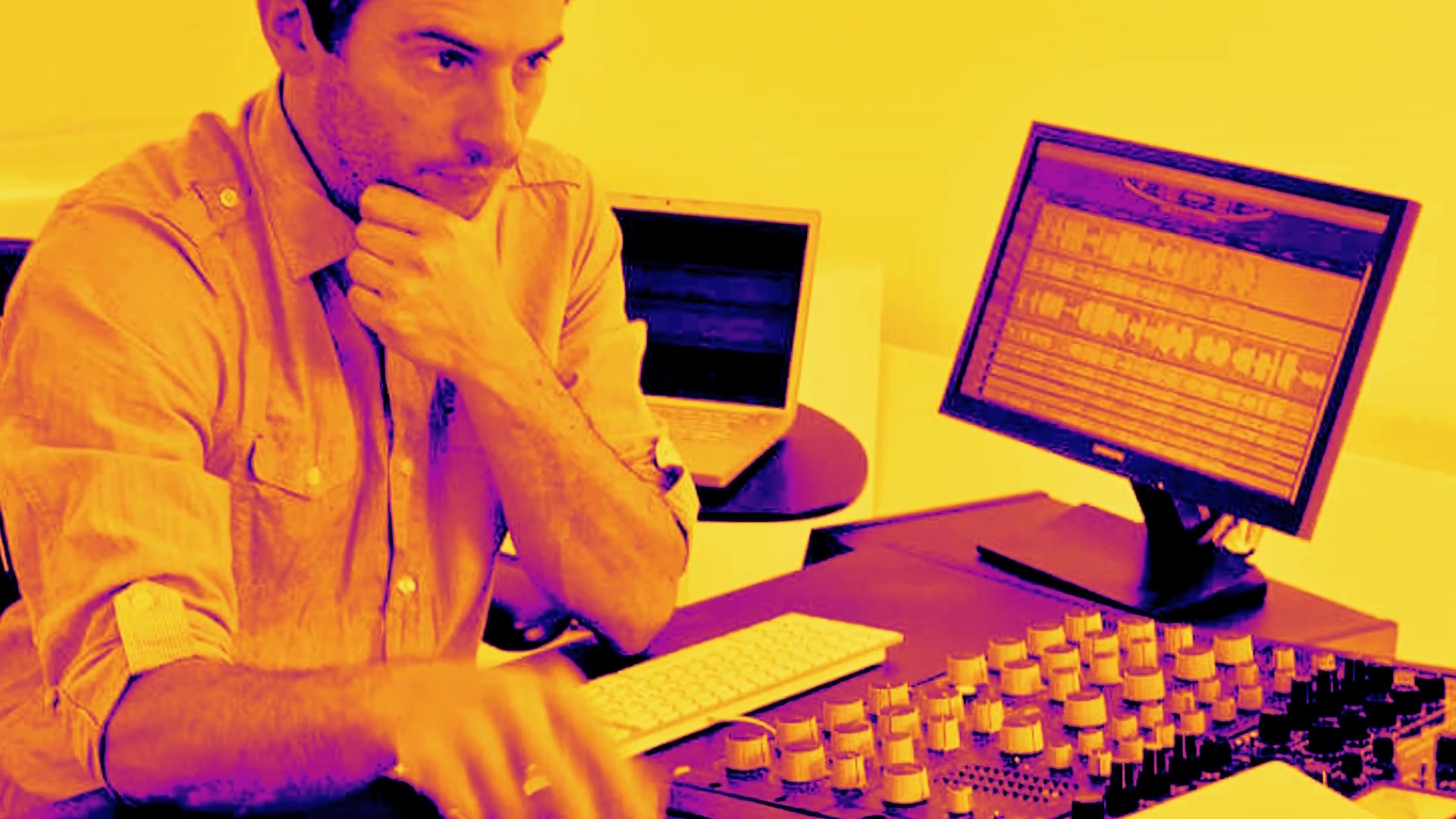 Mastering engineer at the controls