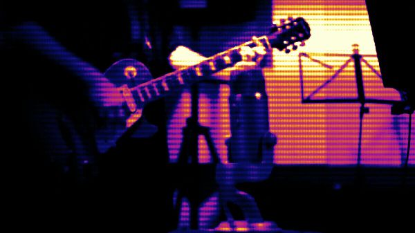 Playing guitar in studio